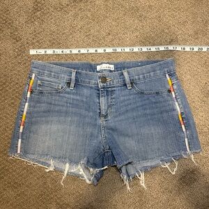 Low rise shirts with embroidery embellishments